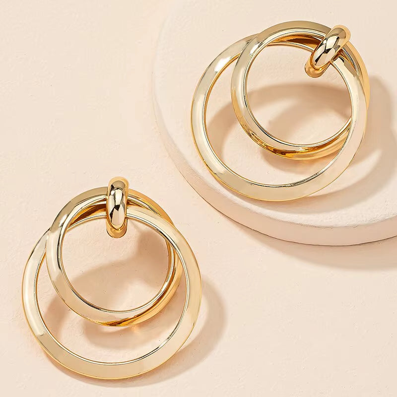 Bold Nights and Twisted Glam– Gold Statement Hoop Earrings