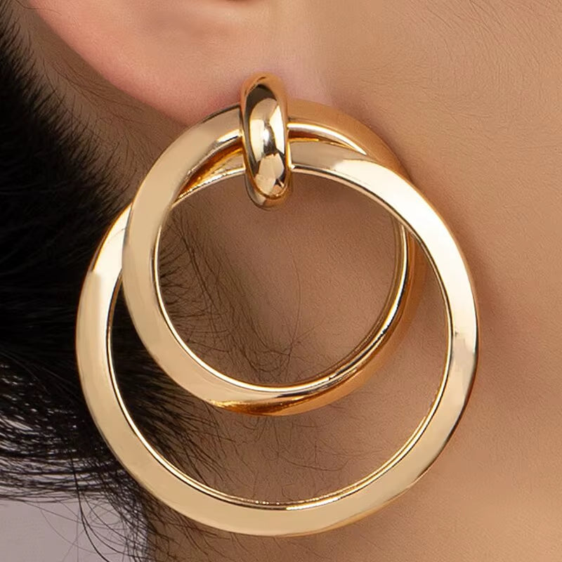 Bold Nights and Twisted Glam– Gold Statement Hoop Earrings