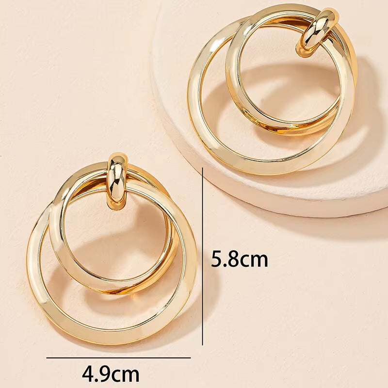 Bold Nights and Twisted Glam– Gold Statement Hoop Earrings